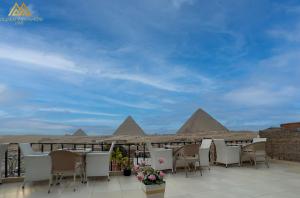 a view of the pyramids from the balcony of a hotel at Golden Pyramids Inn in Cairo