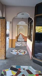 a hallway of a building with colorful tiles on the floor at แอทประจวบ-At Prachuap in Prachuap Khiri Khan