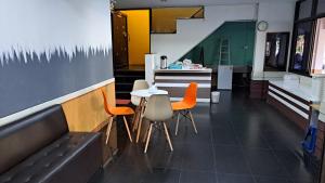 a restaurant with a table and chairs and a counter at แอทประจวบ-At Prachuap in Prachuap Khiri Khan