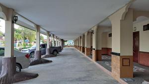 an empty hallway of a building with cars parked at แอทประจวบ-At Prachuap in Prachuap Khiri Khan
