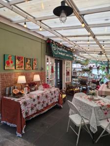 a restaurant with two tables and two chairs at ParabonHaus Kopitiam - Bed & Breakfast in Gegarbensang