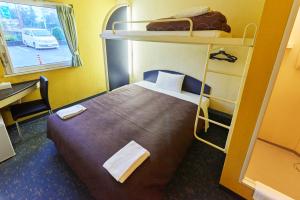 เตียงในห้องที่ Select Inn Numazu