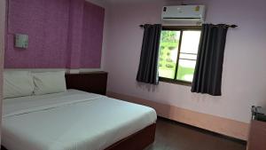 a small bedroom with a bed and a window at แอทประจวบ-At Prachuap in Prachuap Khiri Khan +3 photos