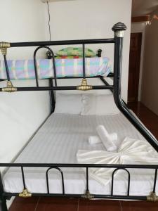 a couple of bunk beds with towels on them at BuenaMaria Mountain Resort in Puerto Galera