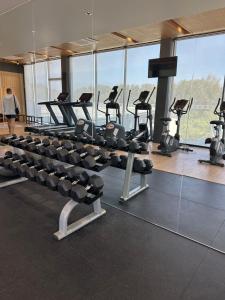 a gym with rows of treadmills and exercise bikes at Wyndham studio 2205 in Surin Beach