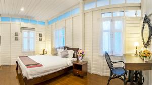 Postel nebo postele na pokoji v ubytování Baankachitpan Bangkok Hotel