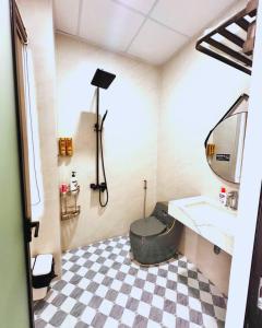 a bathroom with a sink and a mirror at Max Home in Ninh Hải