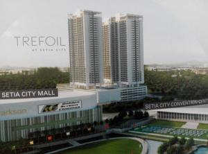 a group of tall buildings in a city at Warm Stay at Trefoil in Setia Alam