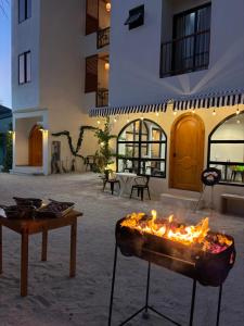 a fire pit in front of a building at Ruka Maldives in Dhiffushi