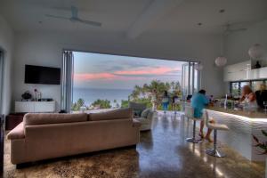 a living room with a view of the ocean at Vacala Bay Resort in Matei