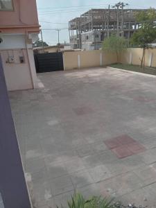 an empty parking lot with a building in the background at Luxury Live Inn Suite in Owuraman