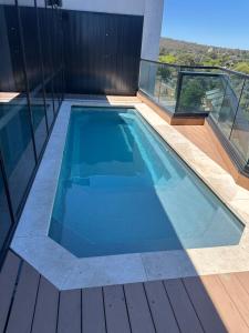 a swimming pool on top of a building at Prime CBD 3BR 2 free parking apartment next to canberra centre in Canberra