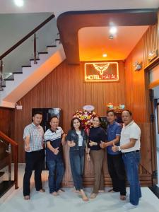 a group of people standing in front of a building at Hotel Hải Âu in Kỳ Trân (1)