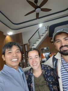 three men posing for a picture in a house at Hotel Hải Âu in Kỳ Trân (1)