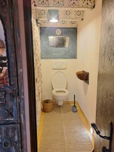 a bathroom with a toilet in a room at maison la Bambine chambre esprit château in Ozolles +51 photos