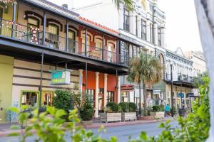 a row of buildings on a city street at Church GTX in Galveston +1 photo