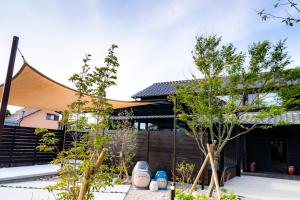a house with a tent in front of it at いとしま風遊 in Itoshima