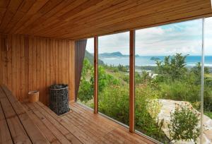 a wooden deck with a view of the ocean at SABA Lombok in Selong Belanak
