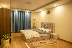a bedroom with a bed and a window at Zen Space in Kathmandu