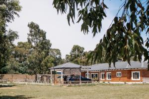 a house with a fence in front of it at La Grande in Benoni