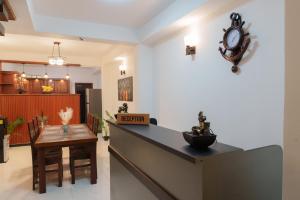 a room with a counter and a clock on the wall at St Anthonys Holiday Inn in Kotagala