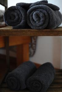 a pile of towels sitting on a shelf at Ferienwohnung Schog in Todtnau +37 photos