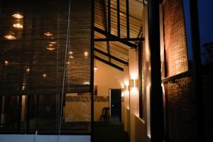 a hallway of a building at night with lights at St Anthonys Holiday Inn in Kotagala