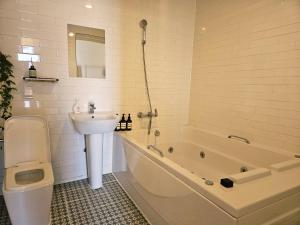 a bathroom with a sink and a toilet and a bath tub at 경기도 양평군 강남로714-14 미니조식무료서비스 in Yangpyeong +63 photos