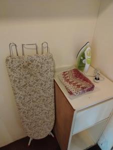 a room with a desk with a sink and a counter top at Hotel Seri Malaysia Port Dickson in Port Dickson