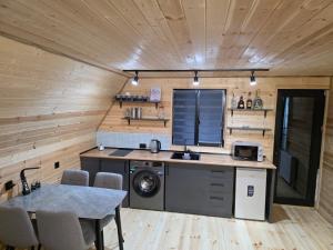 a kitchen and dining room in a tiny house at LizMari in (( Gergeti ))