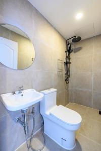 a bathroom with a toilet and a sink at Mountain View Escape at Primrose Hill in Bangrak Beach +25 photos