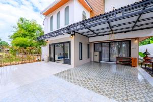 a patio of a home with awning at Mountain View Escape at Primrose Hill in Bangrak Beach