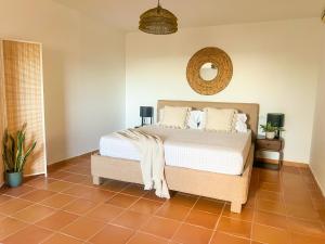 a bedroom with a bed and a mirror on the wall at Casa Panorama in Illes Balears +67 photos