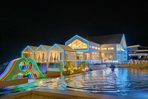 a resort with a swimming pool at night at Fairways and Bluewater Boracay in Boracay