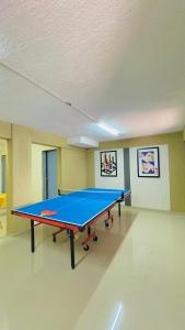 a ping pong table in an empty room at Shubh causy 4bhk villa in Lonavala