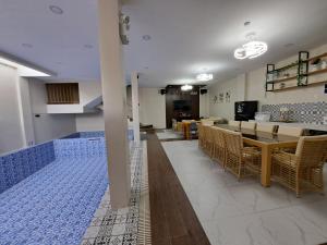 a dining room with a table and chairs at Maywood Private Resort in Calamba