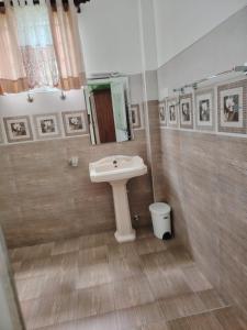 a bathroom with a sink and a toilet at Charlotte Inn in Kandy +33 photos