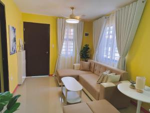 a living room with a couch and a table at Casa Solana at Malaybalay VCDU Phase 3 B4 L22 in Malaybalay