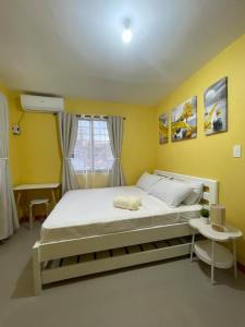 a bedroom with a large bed and a window at Casa Solana at Malaybalay VCDU Phase 3 B4 L22 in Malaybalay