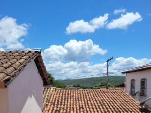 a view of the roof of a building with a blue sky at Casa de Nara in Lençóis +21 photos