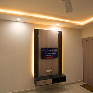 a flat screen tv on a wall in a room at Mithila Resort in Jāmb +11 photos