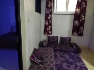a living room with a couch and a window at شقق الخيالي 2 in Tan-Tan