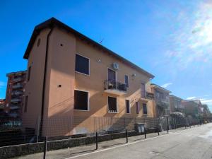 a building on the side of a street at Dolce 2 bedrooms Apartment Milano 2mins to Rho Fiera & 25mins to Duomo Centre & 100m to Metro in Pero