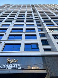 a tall building with a sign on the side of it at Cookie House in Seoul