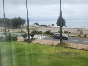 a car is driving down a road near a street at 13 at Santos in Mossel Bay