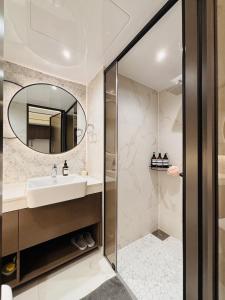 a bathroom with a sink and a mirror at Cookie House in Seoul +22 photos