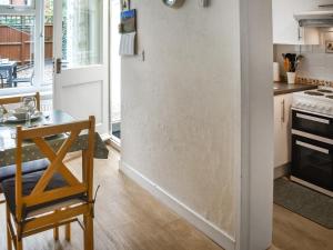 a kitchen with a table and a dining room at Maydrift in Mundesley