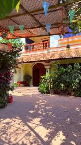 a courtyard of a house with a building at Angkor Sandra Villa in Siem Reap