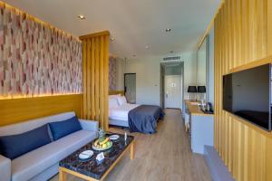 a hotel room with a bed and a couch at Celeste Bella Luxury Hotel & Spa in Bodrum City