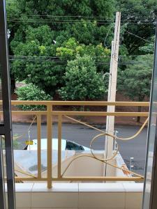 a view from a window of a boat on a street at Suíte de Casal Privativa com Sacada in Sao Jose do Rio Preto +14 photos
